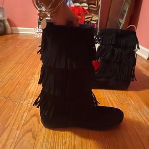 Minnetonka black fringe boots.